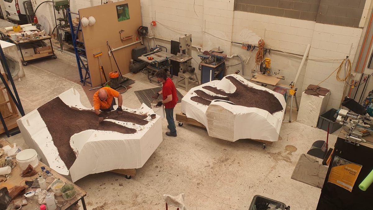 Artisans at the Aeroplane Workshop with the moulds of the giant hand in two parts