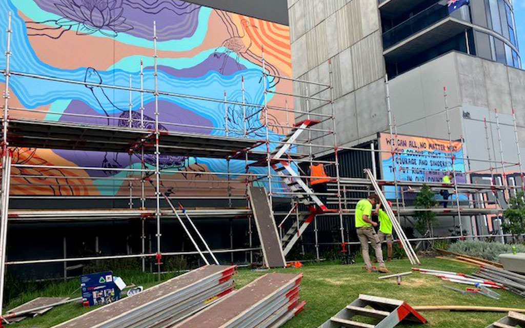 Lilardia mural in progress. Scaffolding being removed